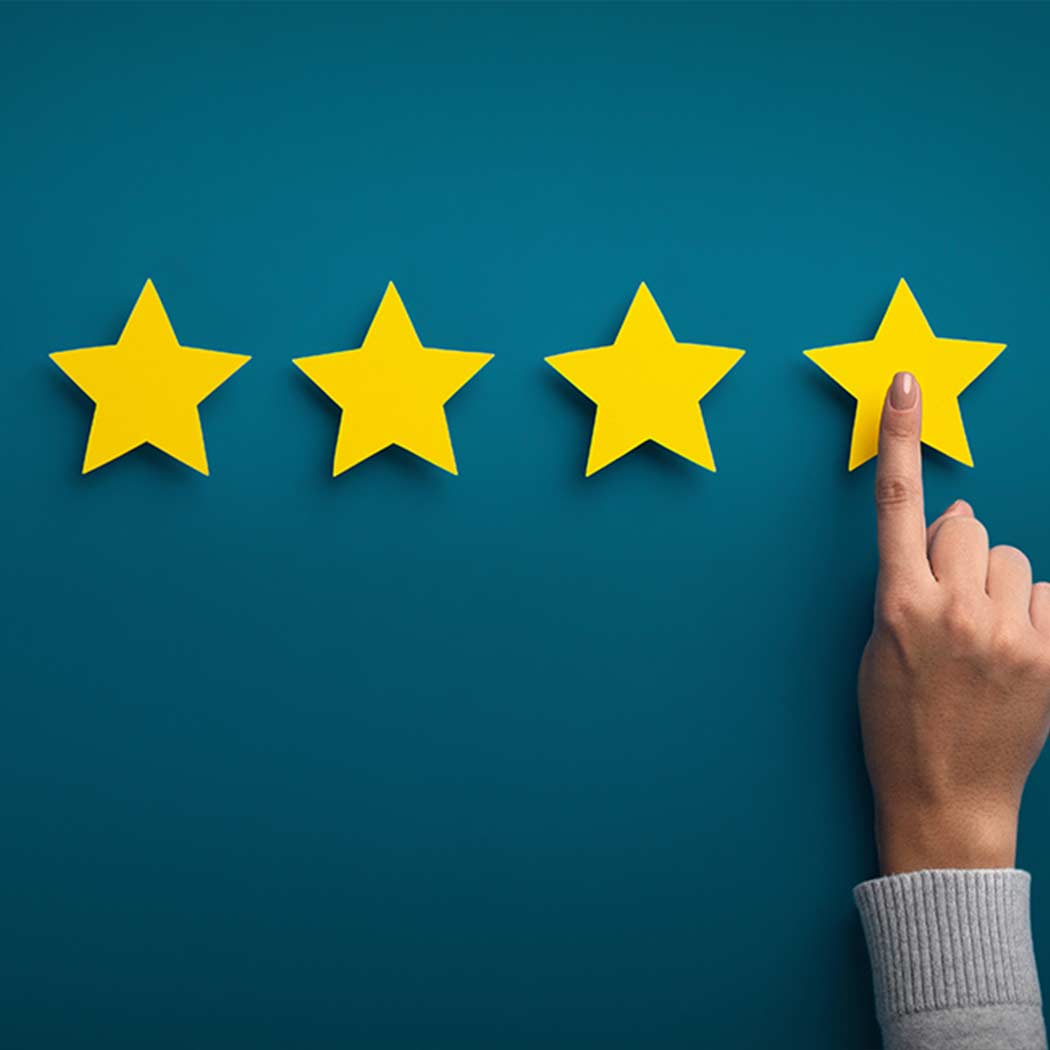 hand pointing to last star on 4-star board, Contact Center Experience | DXC Technology