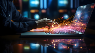 Person typing on laptop with sparks flying, Private AI for the Enterprise | DXC Technology